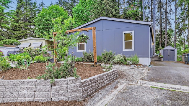 12814 NE 190th Pl, Bothell, WA 98011 - view of front of property featuring a storage unit and an outdoor structure