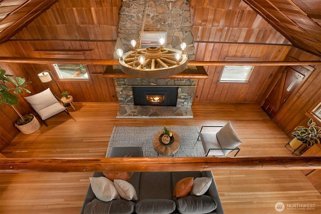 1414 Roy Rd, Bellingham, WA 98229 - living area featuring wood walls, hardwood / wood-style flooring, and a stone fireplace