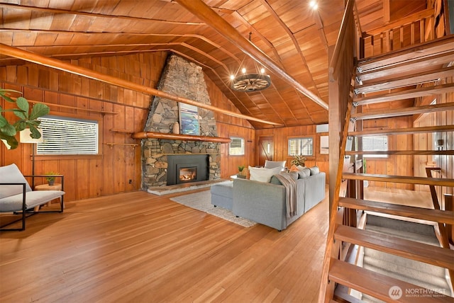 1414 Roy Rd, Bellingham, WA 98229 - living room with lofted ceiling, wood ceiling, plenty of natural light, hardwood / wood-style flooring, and wooden walls