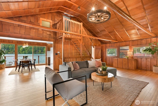 1414 Roy Rd, Bellingham, WA 98229 - living area featuring wood walls, a chandelier, wood ceiling, stairs, and wood-type flooring
