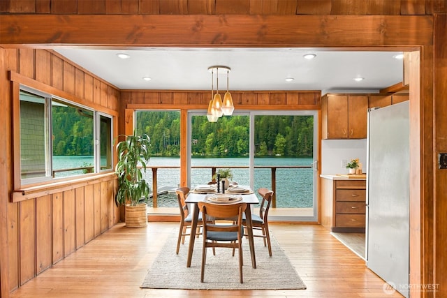 1414 Roy Rd, Bellingham, WA 98229 - dining area featuring wood walls, light wood-style floors, recessed lighting, and a water view