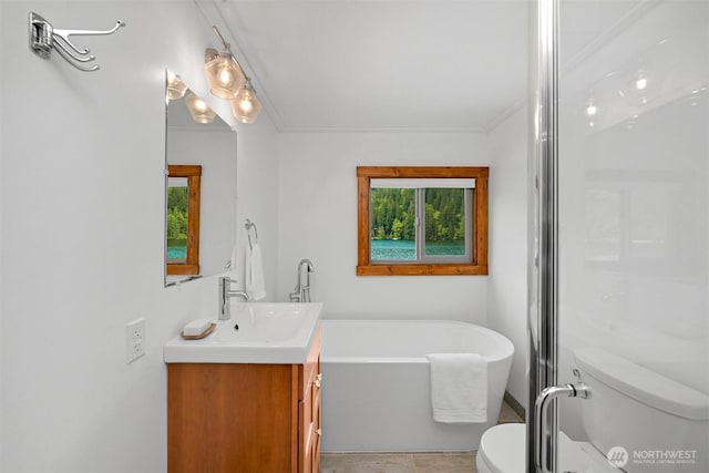 1414 Roy Rd, Bellingham, WA 98229 - bathroom with toilet, a freestanding bath, vanity, and ornamental molding