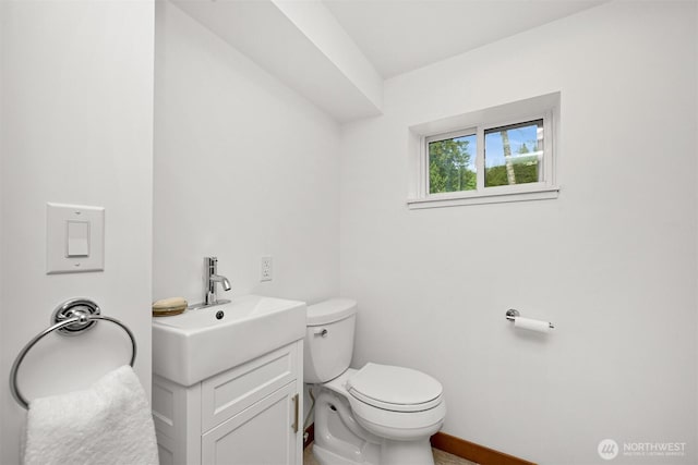 1414 Roy Rd, Bellingham, WA 98229 - half bathroom with toilet, baseboards, and vanity