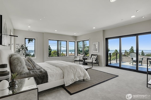 6950 SE Maker St, Mercer Island, WA 98040 - carpeted bedroom with multiple windows, access to outside, and recessed lighting