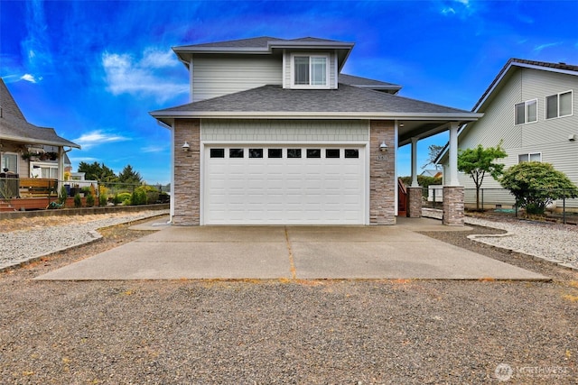 381 Lake Bay Loop SE, Ocean Shores, WA 98569 - view of front of home featuring stone siding, driveway, a garage, and roof with shingles