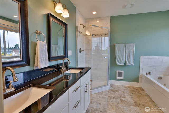 381 Lake Bay Loop SE, Ocean Shores, WA 98569 - full bathroom featuring baseboards, a shower stall, a garden tub, and double vanity