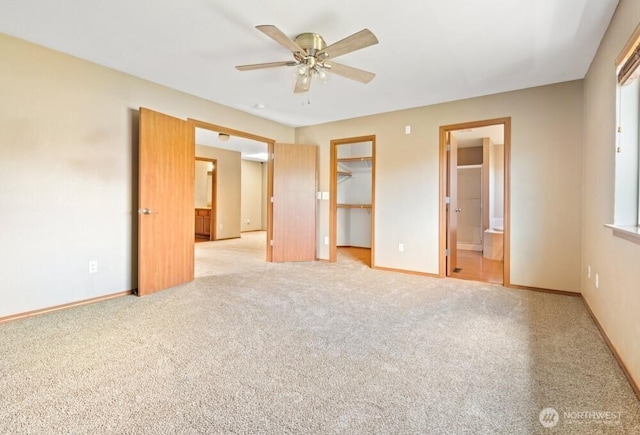 167 Wind River Rd, Chehalis, WA 98532 - unfurnished bedroom featuring carpet, ensuite bath, a walk in closet, baseboards, and a closet
