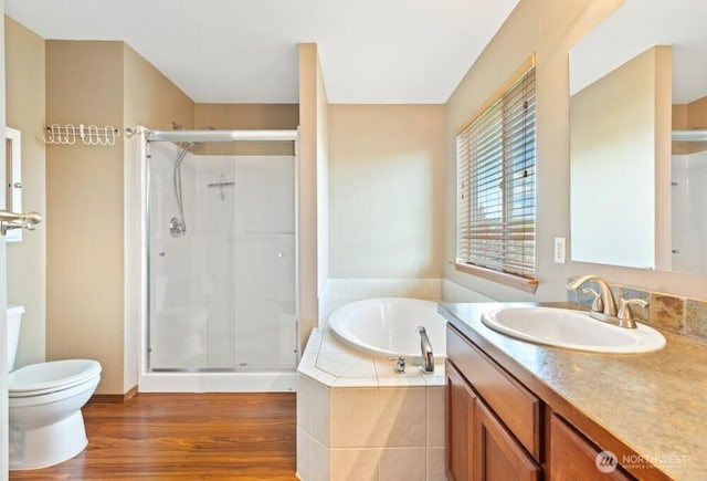 167 Wind River Rd, Chehalis, WA 98532 - full bathroom with a shower stall, a garden tub, toilet, vanity, and wood finished floors