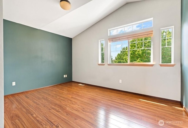 167 Wind River Rd, Chehalis, WA 98532 - empty room featuring lofted ceiling, wood finished floors, and baseboards