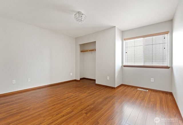 167 Wind River Rd, Chehalis, WA 98532 - unfurnished bedroom with wood finished floors, baseboards, and a closet