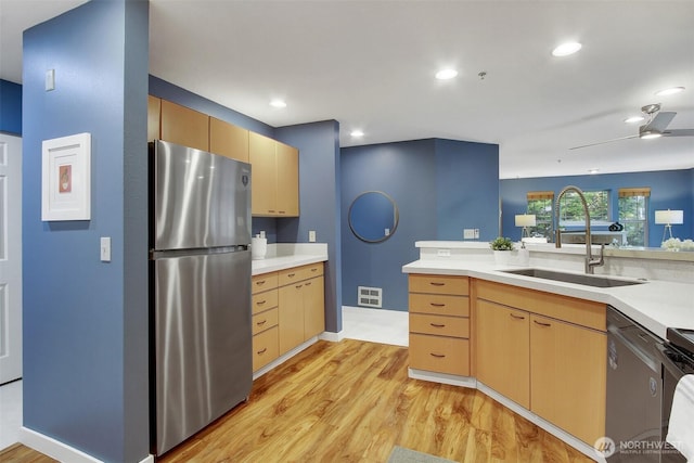 20802 72nd Ave W Unit 304, Edmonds, WA 98026 - kitchen with appliances with stainless steel finishes, a sink, light wood finished floors, light countertops, and recessed lighting