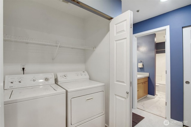 20802 72nd Ave W Unit 304, Edmonds, WA 98026 - clothes washing area with light marble finish flooring and washer and dryer