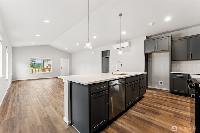 41 E Compass Ln, Allyn, WA 98524 - kitchen with a sink, stainless steel dishwasher, vaulted ceiling, light countertops, and a center island with sink