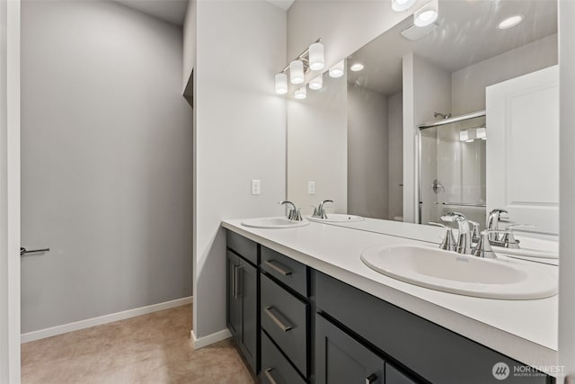 41 E Compass Ln, Allyn, WA 98524 - full bathroom with a shower stall, double vanity, and baseboards