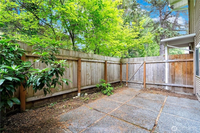 12211 SE 59th St Unit 61, Bellevue, WA 98006 - view of patio featuring a fenced backyard