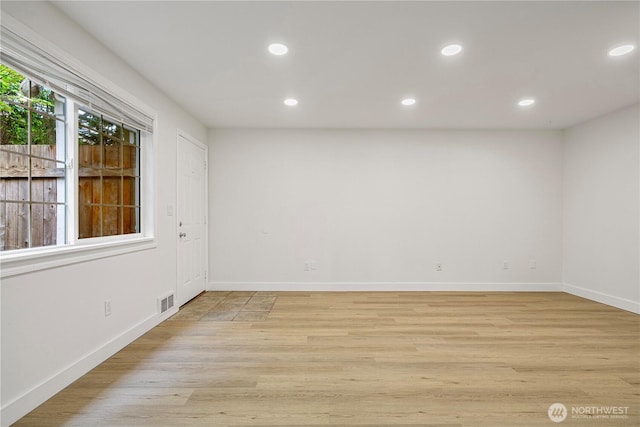 12211 SE 59th St Unit 61, Bellevue, WA 98006 - spare room with recessed lighting, light wood finished floors, and baseboards
