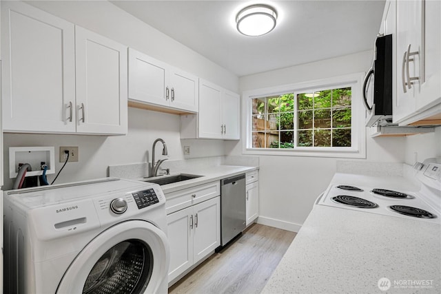 12211 SE 59th St Unit 61, Bellevue, WA 98006 - kitchen featuring washer / clothes dryer, stainless steel dishwasher, a sink, white range with electric cooktop, and white cabinetry