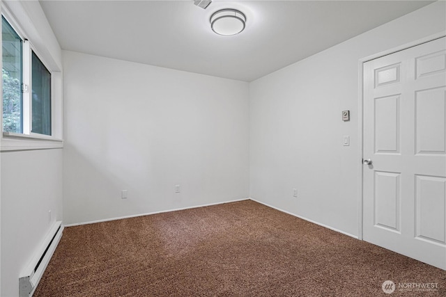 12211 SE 59th St Unit 61, Bellevue, WA 98006 - carpeted empty room with a baseboard heating unit