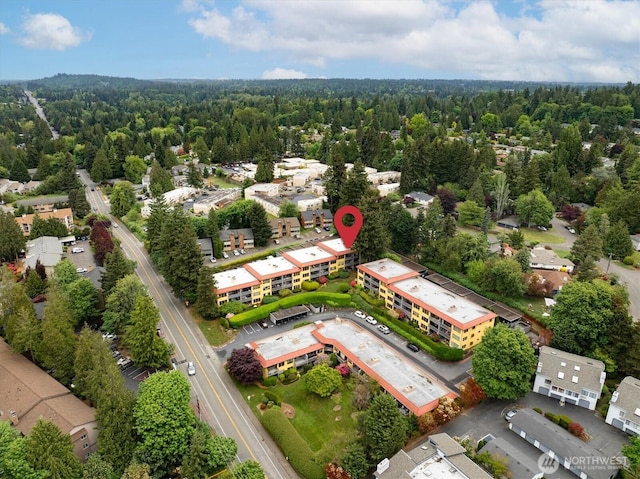 aerial view of property's location with property boundaries highlighted and a forest
