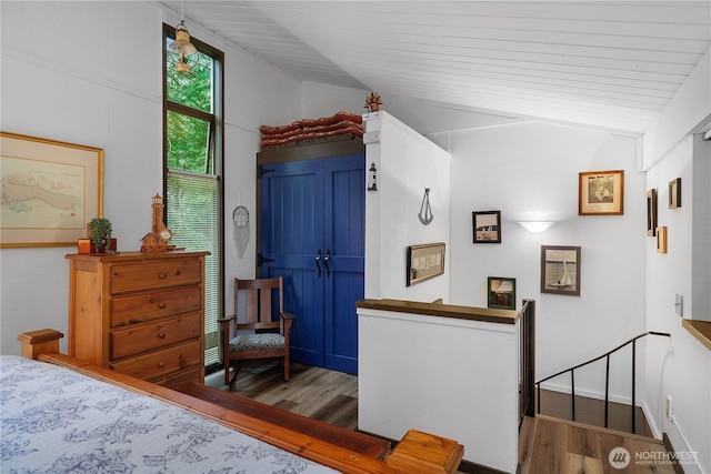 735 E Promontory Rd, Shelton, WA 98584 - bedroom featuring vaulted ceiling and wood finished floors