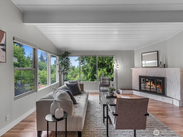 8711 Bowdoin Way, Edmonds, WA 98026 - living area with plenty of natural light, a brick fireplace, and wood finished floors