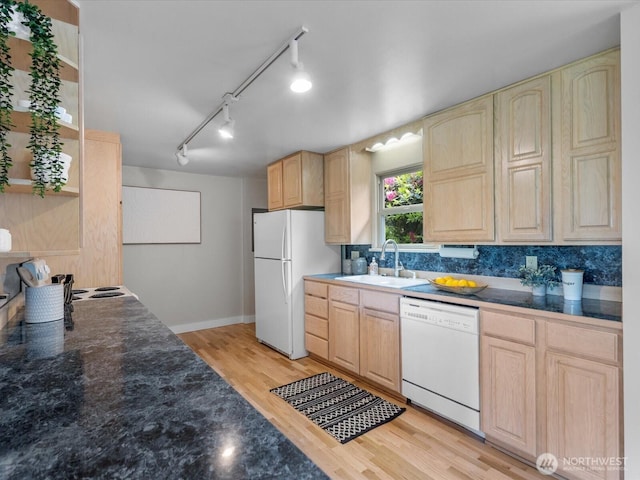 8711 Bowdoin Way, Edmonds, WA 98026 - kitchen with white appliances, a sink, light brown cabinets, light wood finished floors, and dark countertops
