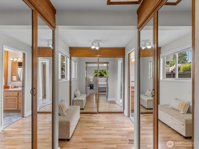 8711 Bowdoin Way, Edmonds, WA 98026 - hall with light wood finished floors and a sink