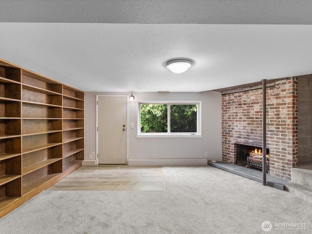8711 Bowdoin Way, Edmonds, WA 98026 - unfurnished living room featuring carpet, a brick fireplace, and a textured ceiling