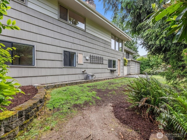 8711 Bowdoin Way, Edmonds, WA 98026 - view of side of home with a chimney