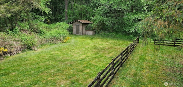 22930 115th Ave SW, Vashon, WA 98070 - view of yard with a storage shed, an outdoor structure, and a wooded view