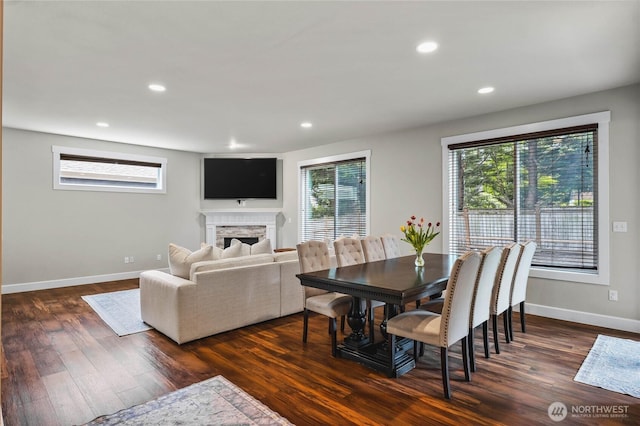 6410 83rd Avenue Ct W, University Place, WA 98467 - dining area with a fireplace, dark wood-type flooring, baseboards, healthy amount of natural light, and recessed lighting