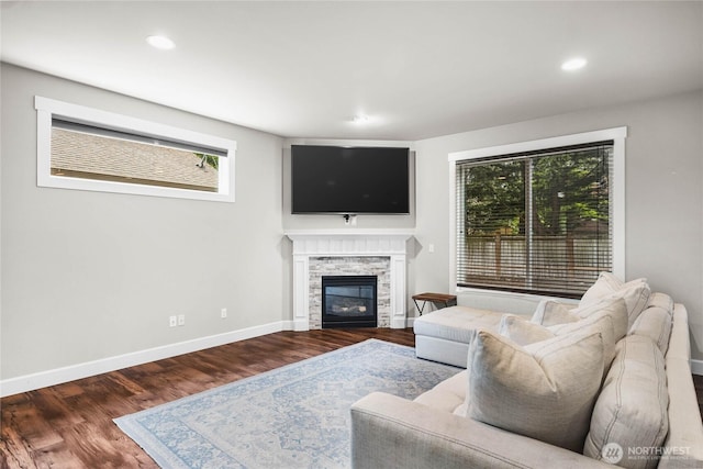 6410 83rd Avenue Ct W, University Place, WA 98467 - living room with wood finished floors, baseboards, a stone fireplace, and recessed lighting