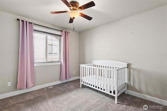6410 83rd Avenue Ct W, University Place, WA 98467 - carpeted bedroom featuring baseboards, a crib, and ceiling fan