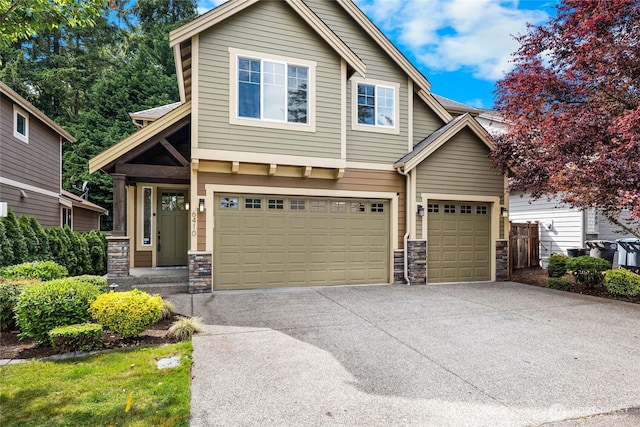 6410 83rd Avenue Ct W, University Place, WA 98467 - view of front of house with stone siding, concrete driveway, and an attached garage