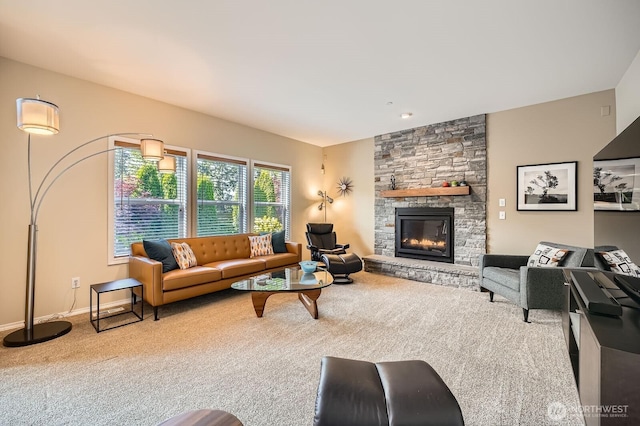 922 Chelan Ave NE, Renton, WA 98059 - carpeted living room featuring a stone fireplace and baseboards