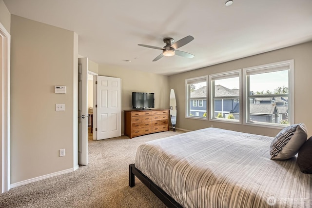 922 Chelan Ave NE, Renton, WA 98059 - bedroom with light colored carpet, baseboards, and a ceiling fan