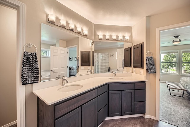 922 Chelan Ave NE, Renton, WA 98059 - ensuite bathroom with double vanity and baseboards