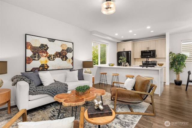 919 N 103rd St Unit A, Seattle, WA 98133 - living area with recessed lighting, wood finished floors, and baseboards