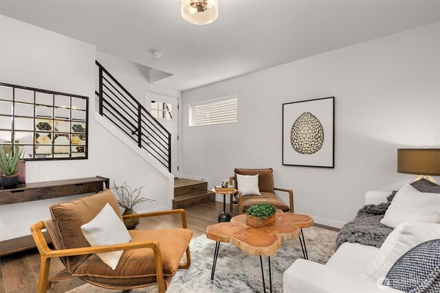 919 N 103rd St Unit A, Seattle, WA 98133 - living area with stairway, wood finished floors, and baseboards