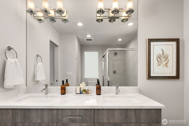 919 N 103rd St Unit A, Seattle, WA 98133 - full bathroom featuring a stall shower, recessed lighting, and double vanity