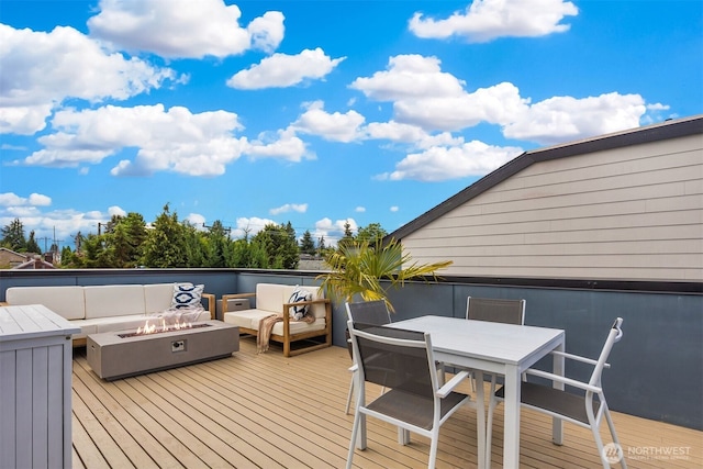 919 N 103rd St Unit A, Seattle, WA 98133 - wooden deck featuring an outdoor living space with a fire pit and outdoor dining area