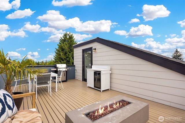 919 N 103rd St Unit A, Seattle, WA 98133 - wooden terrace with an outdoor fire pit, a grill, and outdoor dining area
