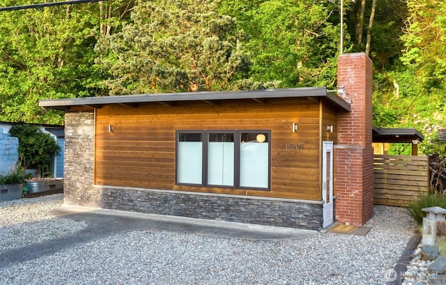 14207 Evergreen Way, Stanwood, WA 98292 - view of side of home with stone siding and a chimney