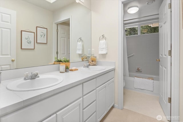 full bath with double vanity, toilet, and shower / bathtub combination with curtain