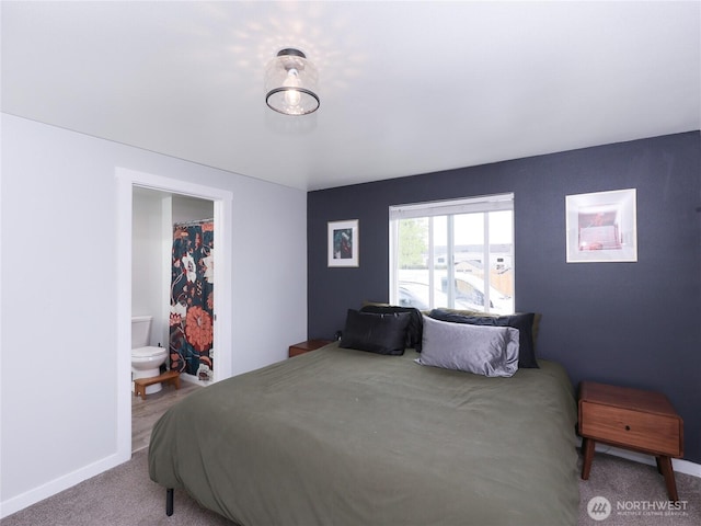 bedroom with carpet and baseboards