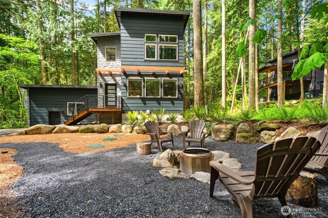 7467 Canyon View Dr, Deming, WA 98244 - rear view of property with an outdoor fire pit and stairs