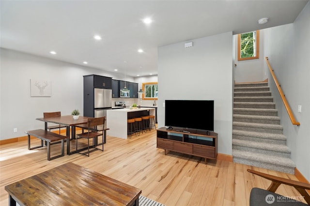 7467 Canyon View Dr, Deming, WA 98244 - living area featuring light wood-style floors, stairs, recessed lighting, and baseboards