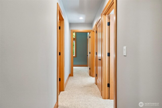 7467 Canyon View Dr, Deming, WA 98244 - hallway featuring light carpet and baseboards
