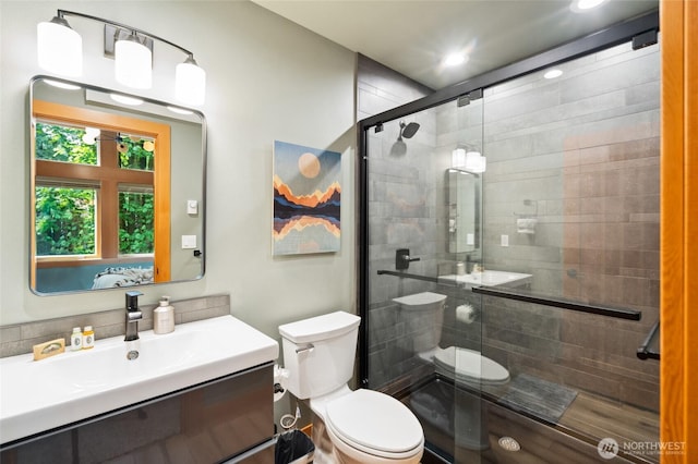 7467 Canyon View Dr, Deming, WA 98244 - bathroom featuring toilet, a stall shower, vanity, and recessed lighting