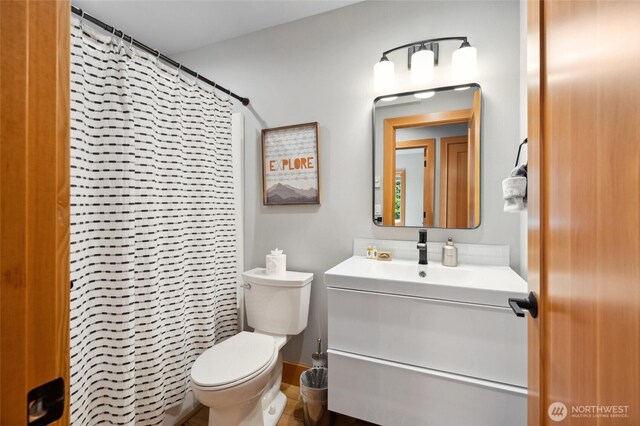 7467 Canyon View Dr, Deming, WA 98244 - bathroom with toilet, vanity, and a shower with shower curtain